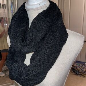 Black knitted infinity scarf with light sparkle